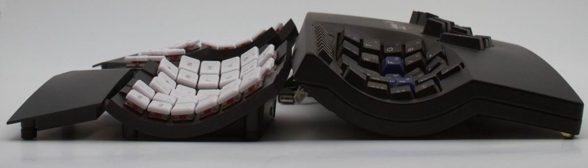 A comparison of the Glove80 and the Advantage from a side view, showing that the Glove80 is shorter, and it keys sit closer to the desktop