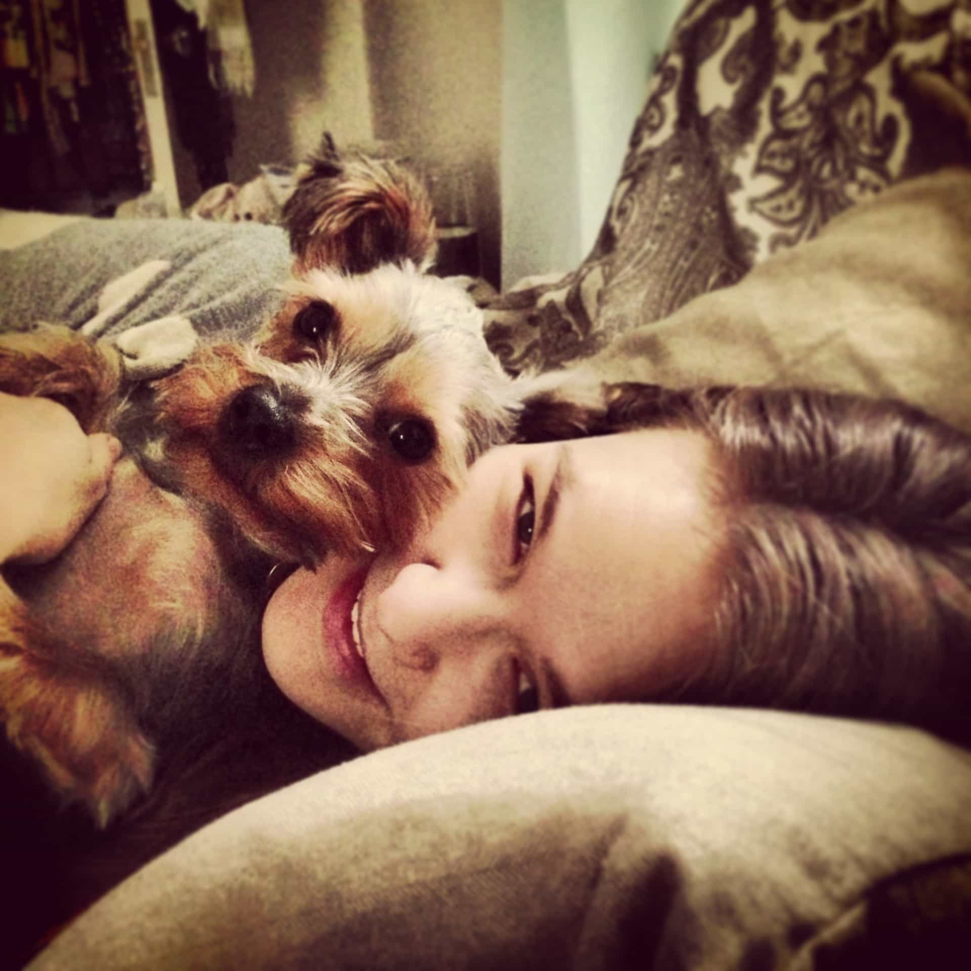 Griff, snuggling with my smiling wife on the couch